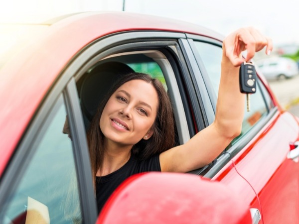 Woman in a Red Car