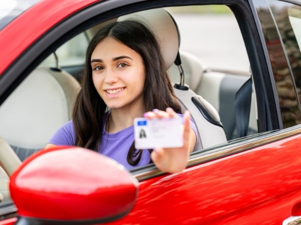 Young Woman Holding Her Driver's License