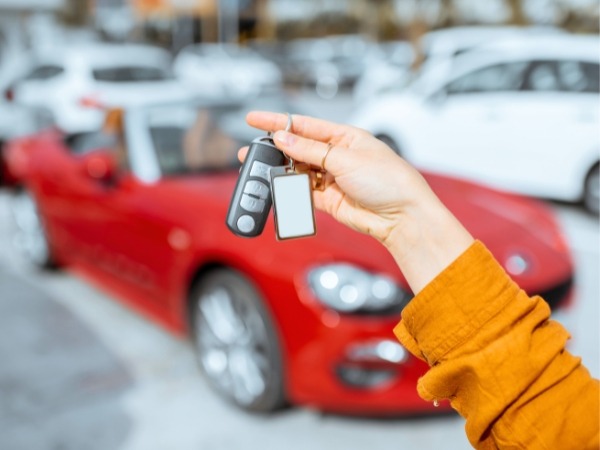 Woman Holding a Car Key