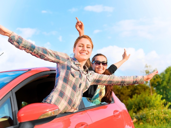 Women inside a Red Car